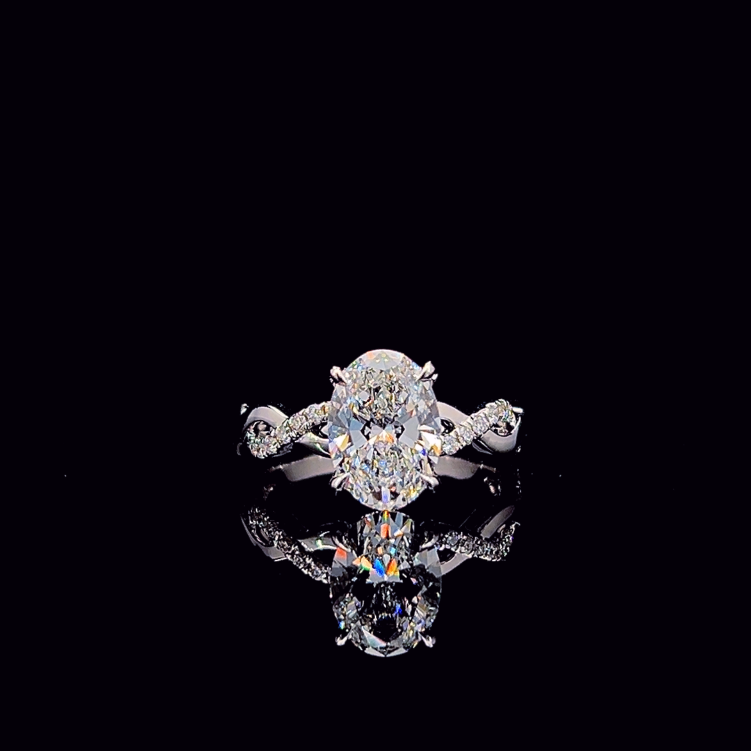 Oval cross-band engagement ring