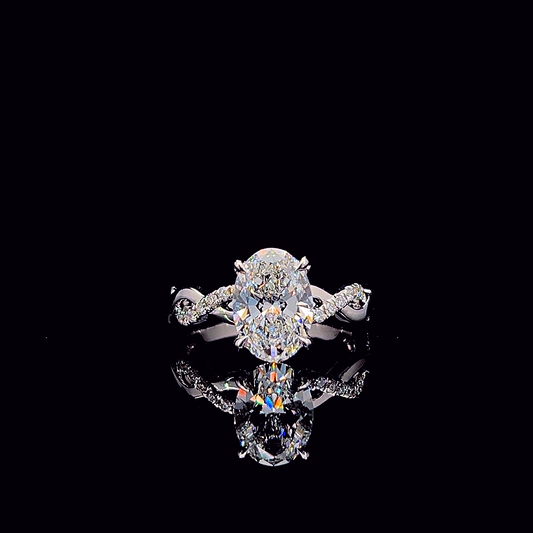 Oval cross-band engagement ring